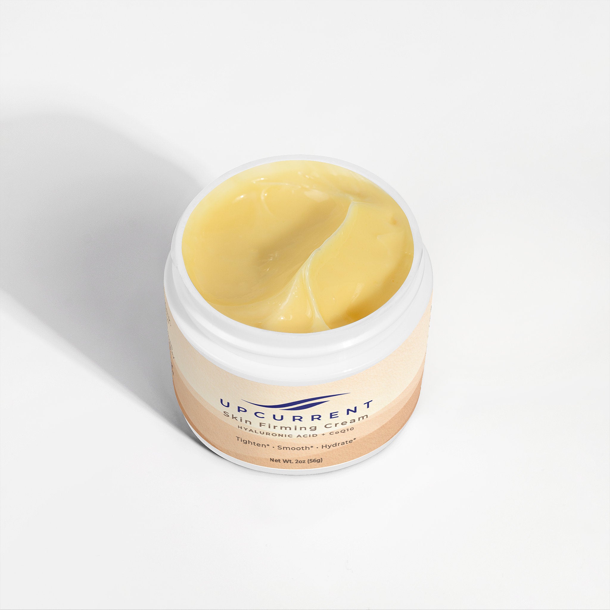 Jar of skincare cream with visible brand name on a white background
