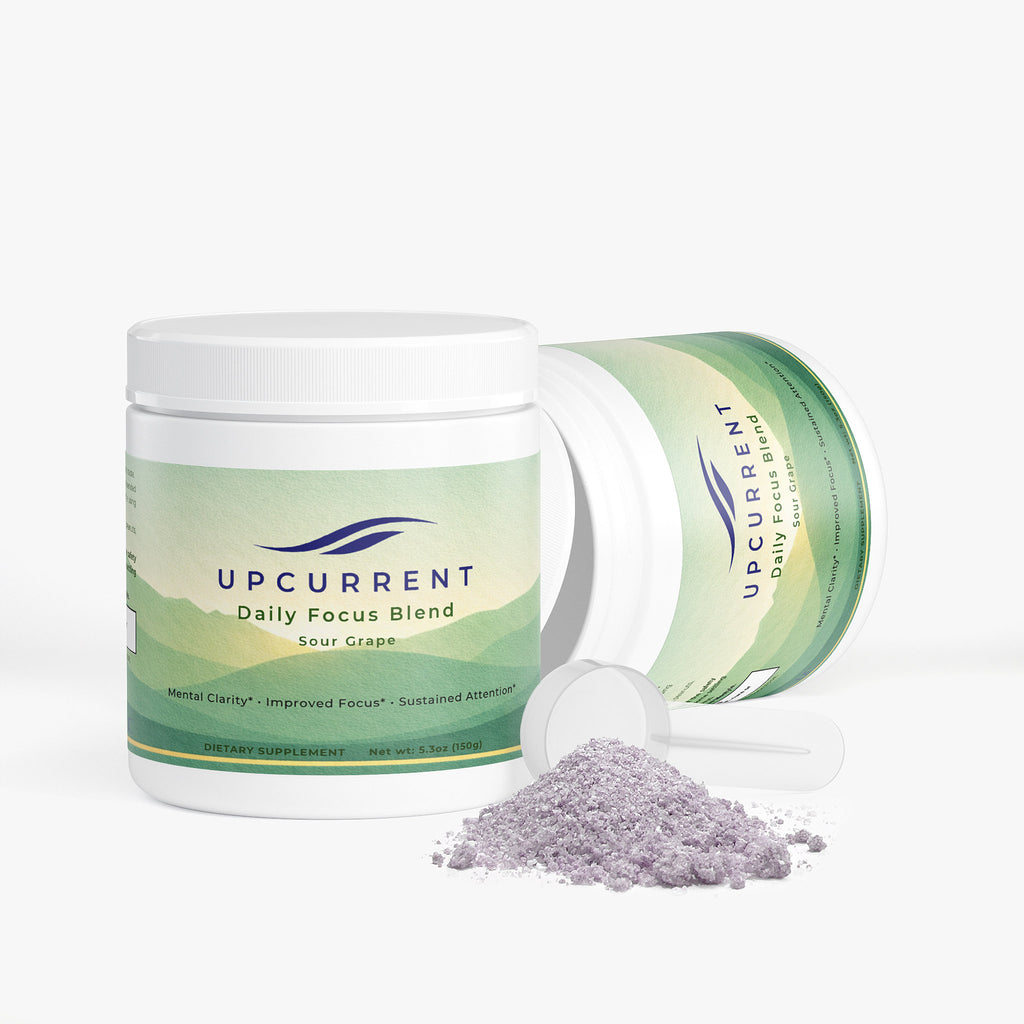 Upcurrent Daily Focus Blend container with spilled powder on a white background
