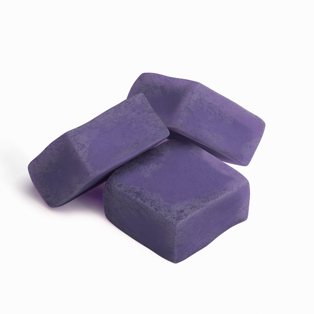 Three purple gummies on a white background