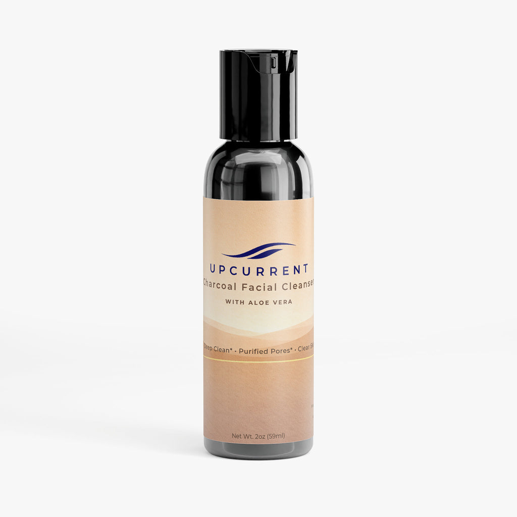 Bottle of Upcurrent Charcoal Facial Cleanser with Aloe Vera on a white background