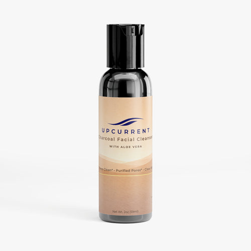 Bottle of Upcurrent Charcoal Facial Cleanser with Aloe Vera on a white background