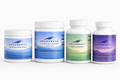 Four bottles of Upcurrent supplements on a white background